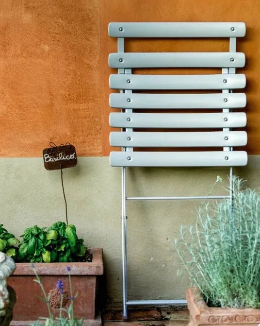 Emu ARC EN CIEL folding outdoor chair - example of chair stored away